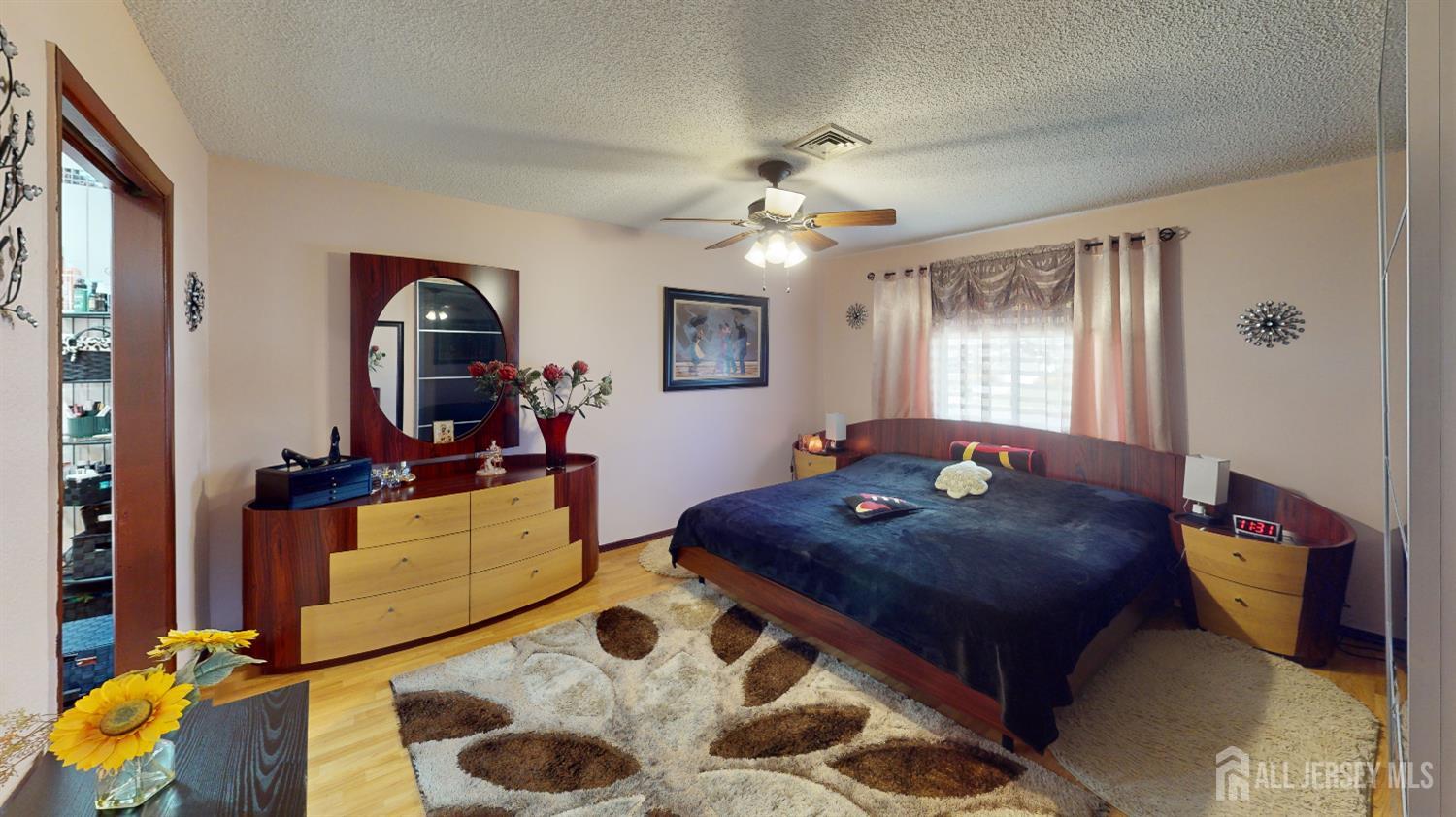 452A Closter Road, Unit B Monroe Township, NJ 08831 - Photo 25 of 46 a living room with furniture and a flat screen tv