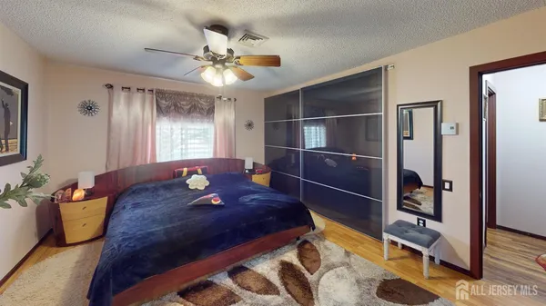 a kitchen with stainless steel appliances kitchen island granite countertop a stove and a refrigerator