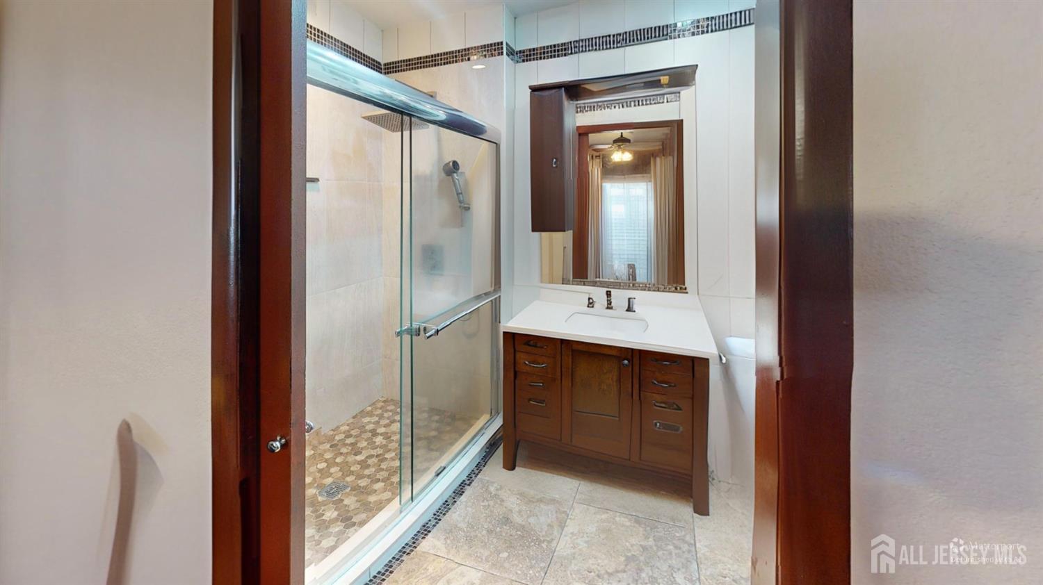 452A Closter Road, Unit B Monroe Township, NJ 08831 - Photo 29 of 46 a bathroom with a shower sink and mirror