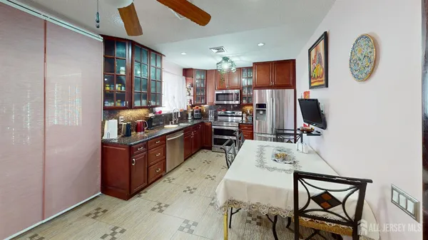 a view of hallway with wooden floor