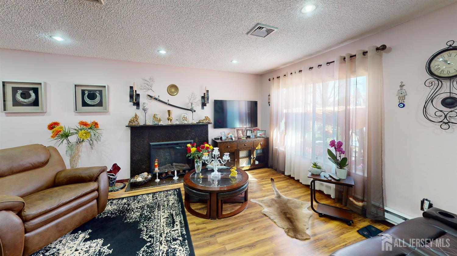 452A Closter Road, Unit B Monroe Township, NJ 08831 - Photo 33 of 46 a living room with furniture and a fireplace