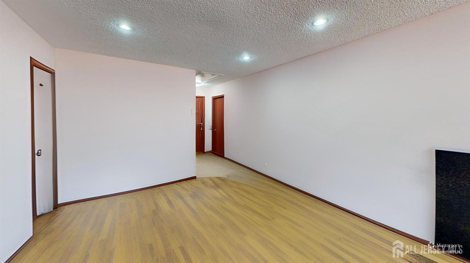 452A Closter Road, Unit B Monroe Township, NJ 08831 - Photo 34 of 46 a view of hallway with wooden floor