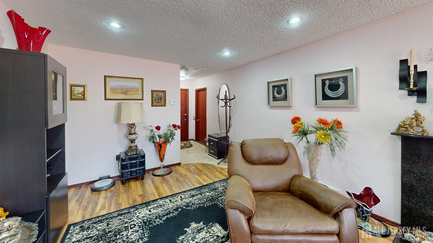 452A Closter Road, Unit B Monroe Township, NJ 08831 - Photo 35 of 46 a living room with furniture and a flat screen tv