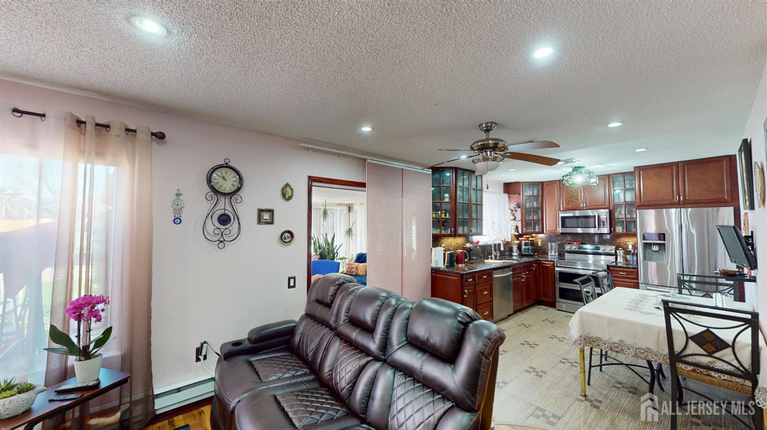 452A Closter Road, Unit B Monroe Township, NJ 08831 - Photo 4 of 46 a living room with furniture kitchen view and a window