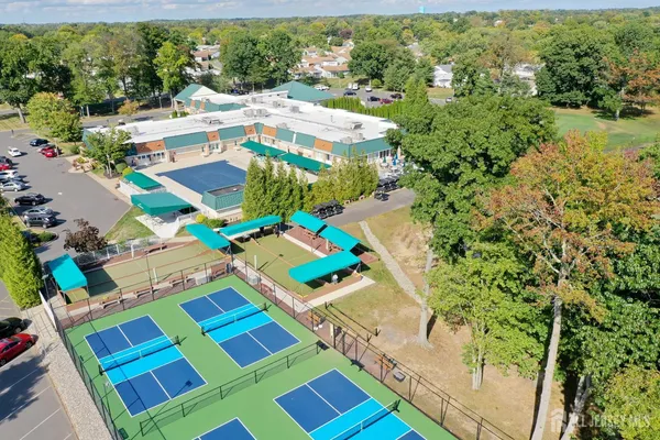 an aerial view of a house with a garden