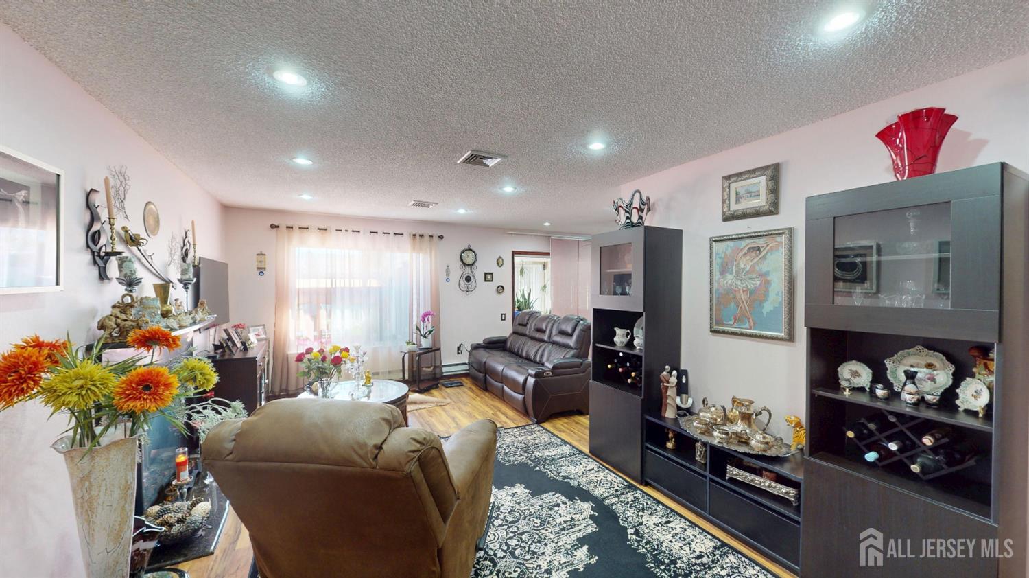 452A Closter Road, Unit B Monroe Township, NJ 08831 - Photo 5 of 46 a living room with furniture and flowers