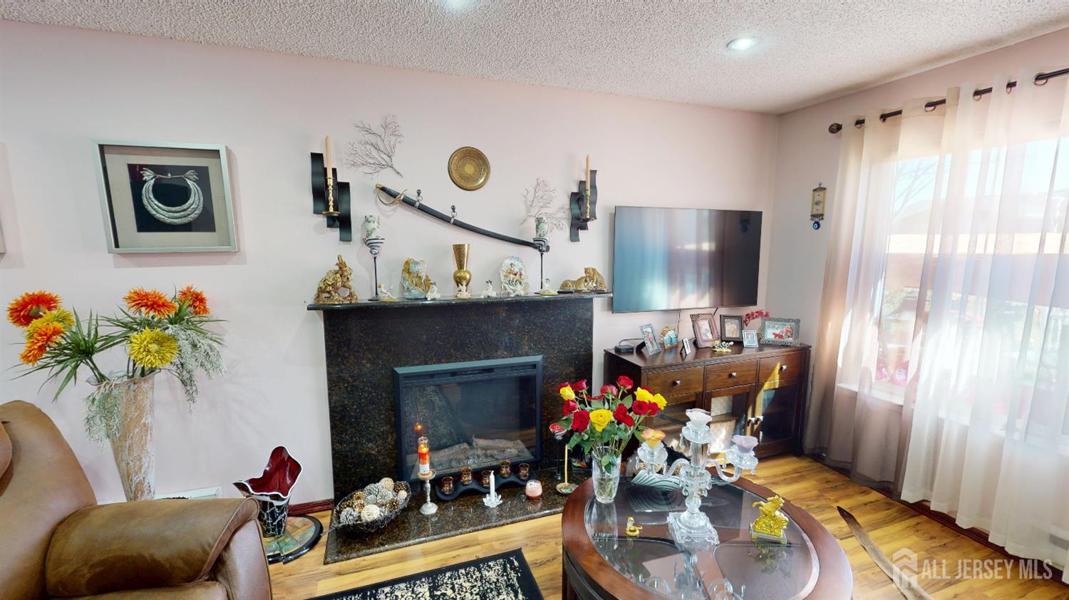 452A Closter Road, Unit B Monroe Township, NJ 08831 - Photo 7 of 46 a living room with furniture potted plant and a fireplace