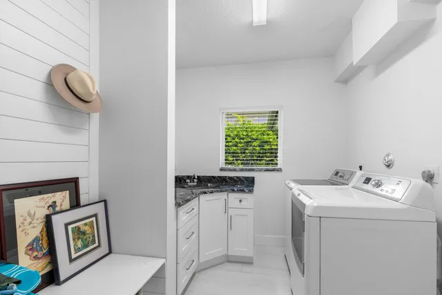 a utility room with closet dryer and washer