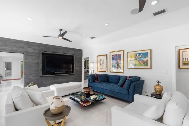 a living room with furniture couches and a fireplace