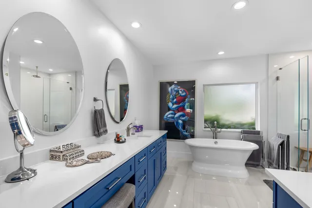 a bathroom with a double vanity sink and a mirror