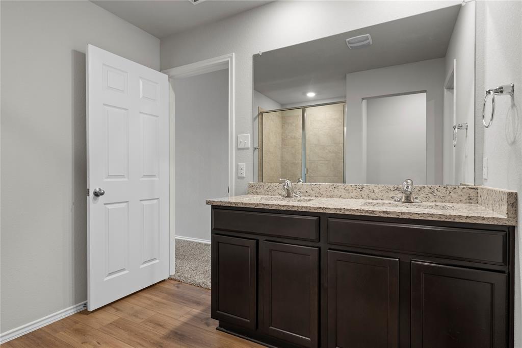 3012 Sherco Road Lorena, TX 76655 - Photo 8 of 14 a bathroom with a granite countertop sink and a mirror