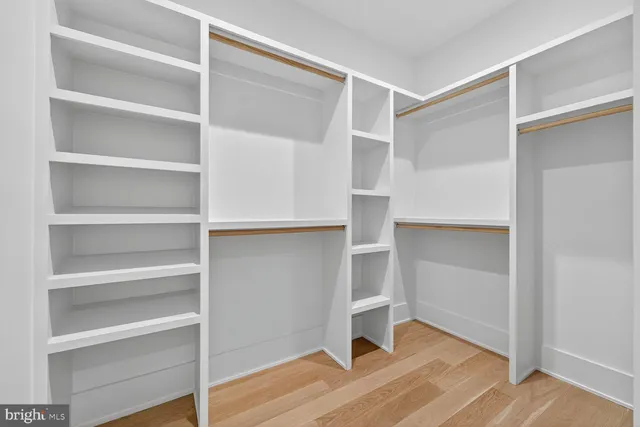 a view of an empty walk in closet