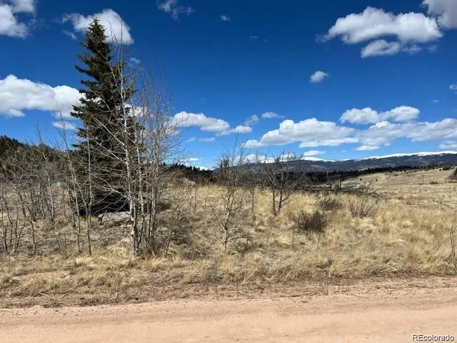 a view of a lake with a house in the background