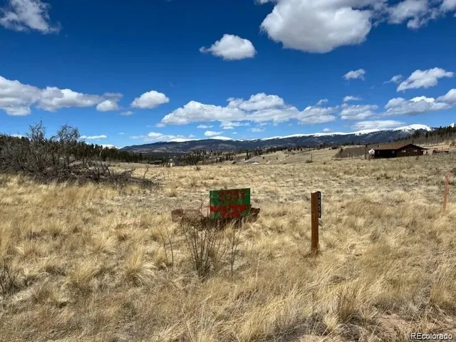 a view of a lake in the sunset