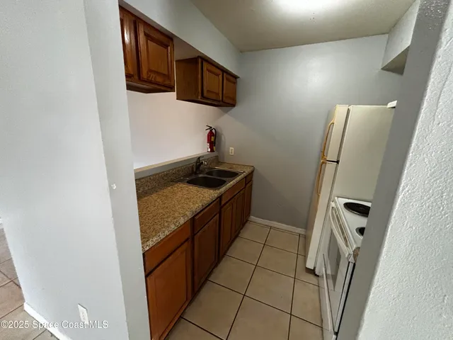 a bathroom with a toilet a sink and shower