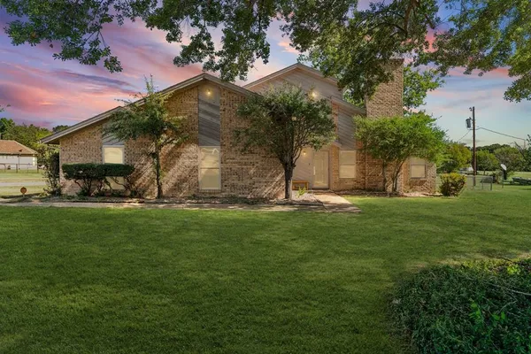 a view of a garden with a building