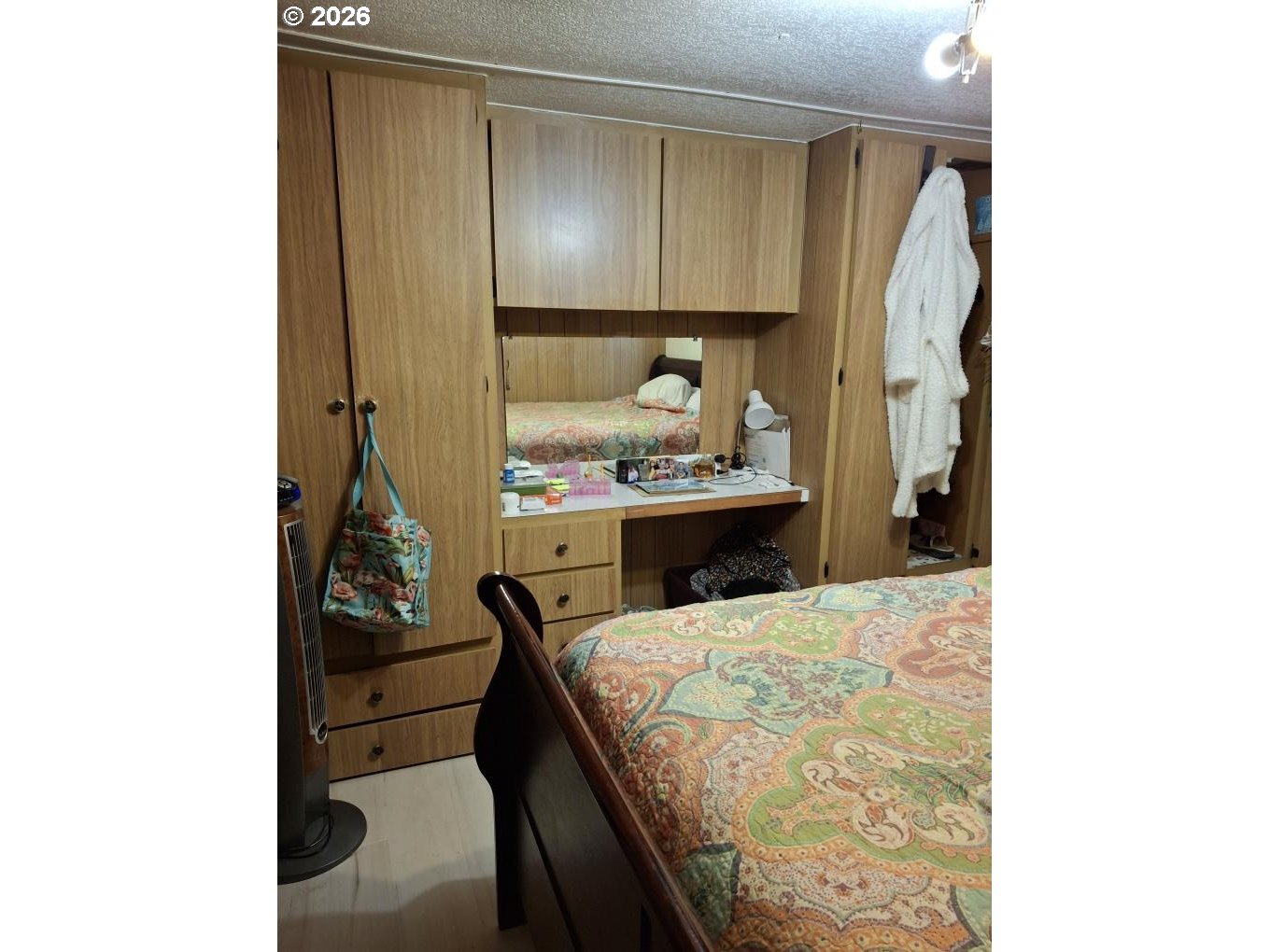 3950 Coburg Road, Unit 3 Eugene, OR 97408 - Photo 3 of 14 a bed room with a bed and a mirror