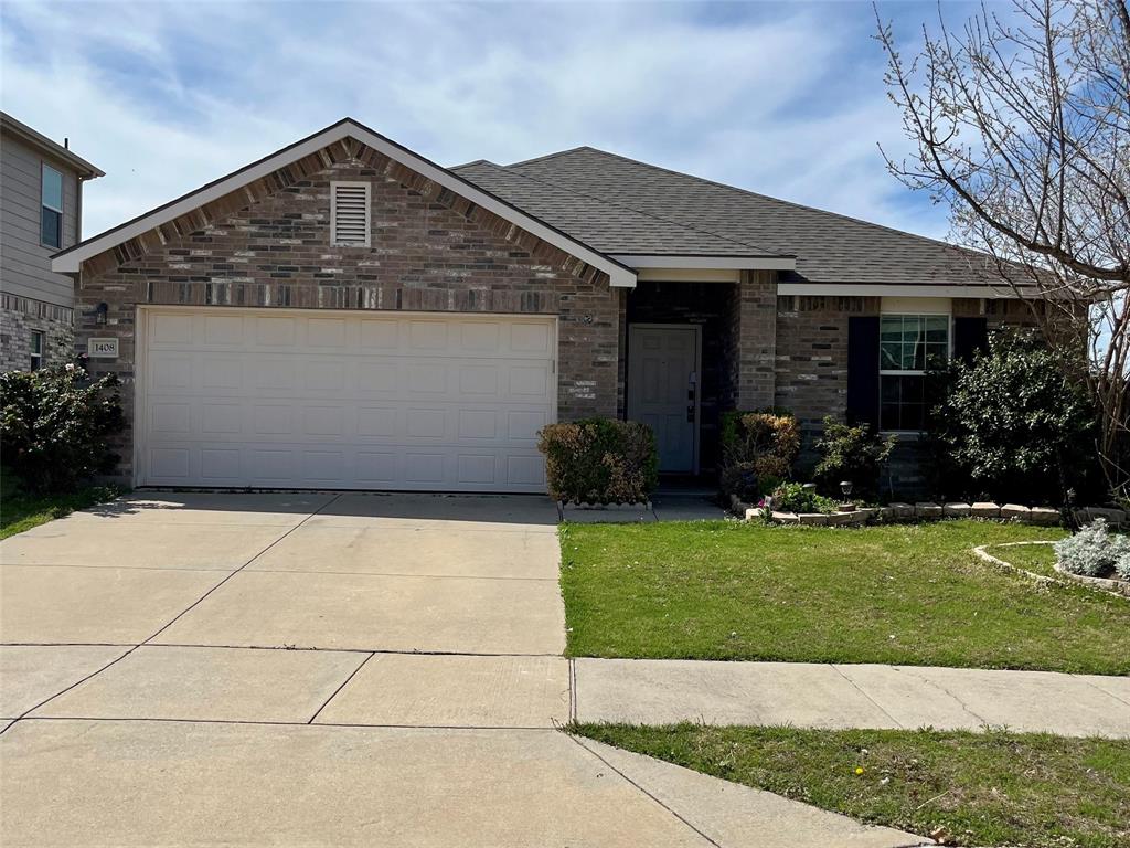 View of front of house with a shingled roof, brick siding, a front lawn, driveway, and an attached garage
