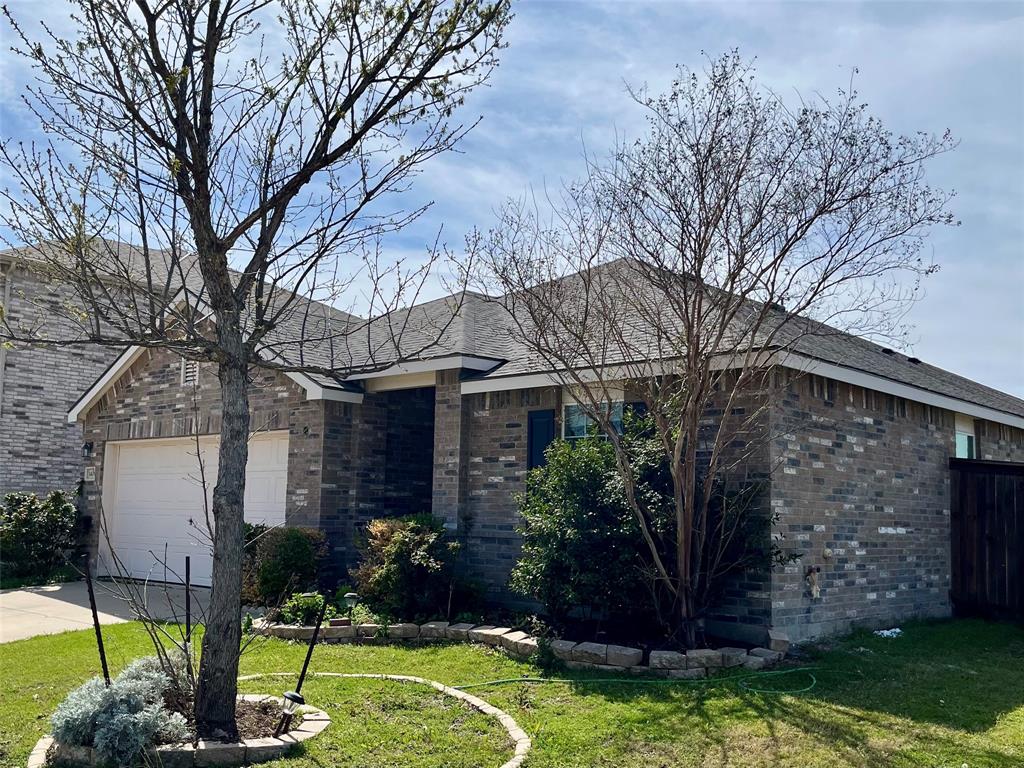 1408 Rivers Creek Lane Little Elm, TX 75068 - Photo 2 of 3 Single story home with brick siding, a front lawn, an attached garage, and driveway