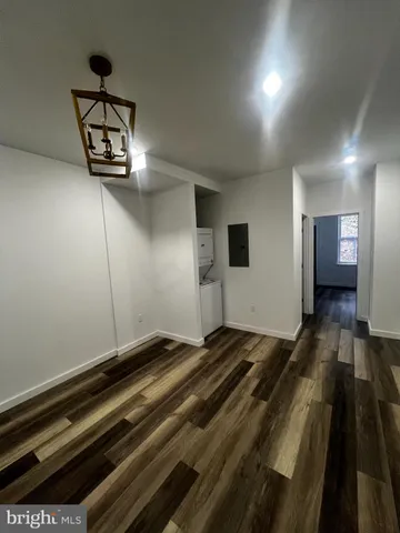 a view of a room with wooden floor