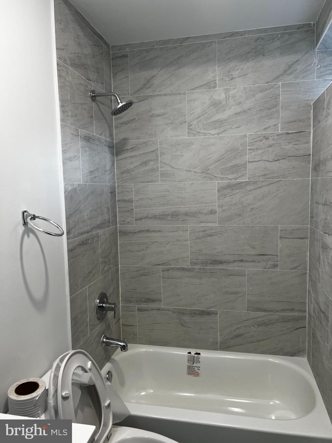 1551 Church Street, Unit 1 Philadelphia, PA 19124 - Photo 6 of 8 a bathroom with a sink a toilet and shower