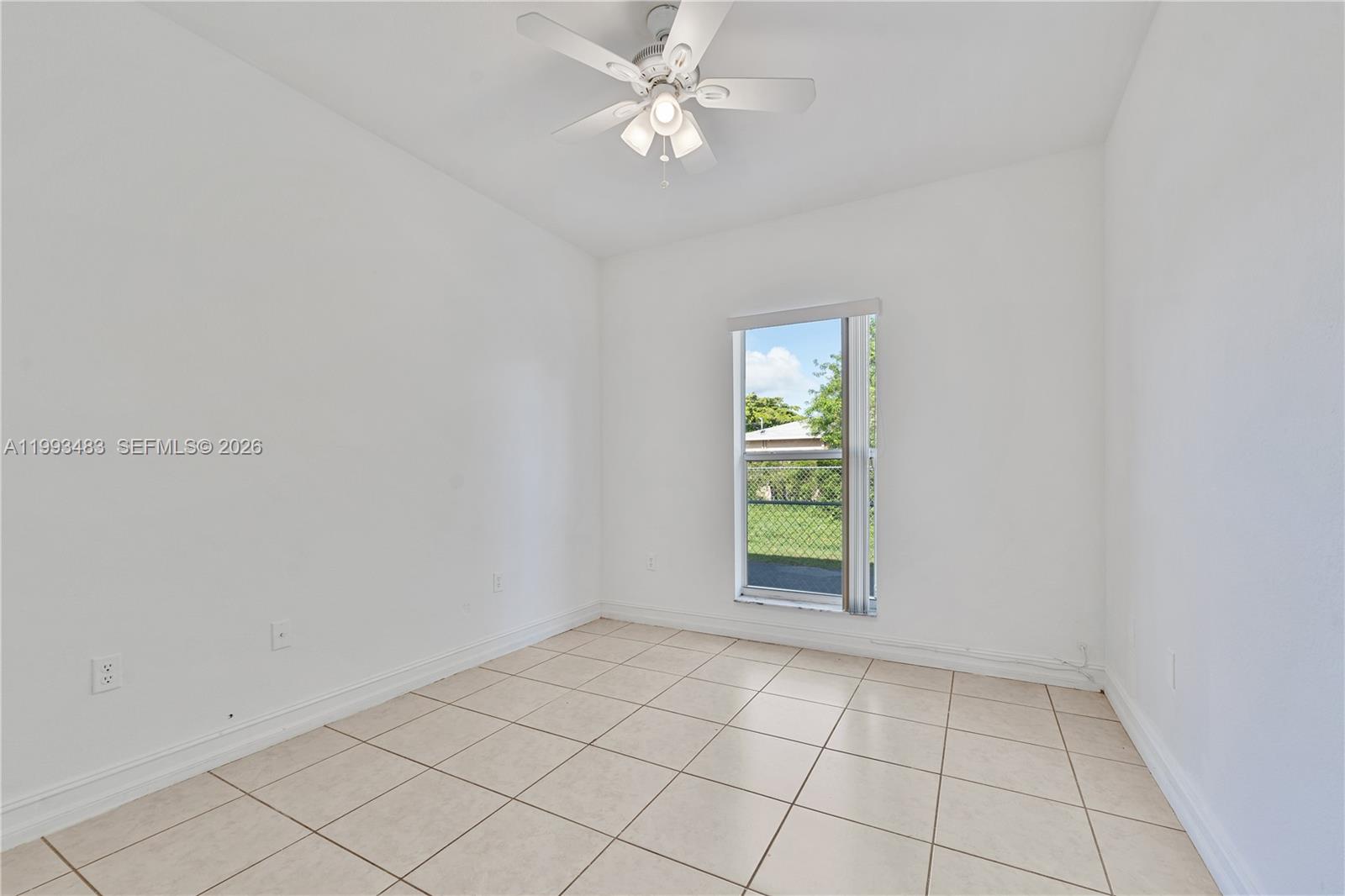 10357 Southwest 178th Street, Unit 10357 Miami, FL 33157 - Photo 15 of 25 an empty room with windows and fan