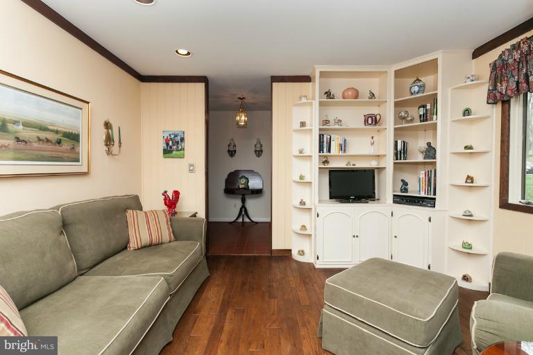 14206 Sagewood Road Phoenix, MD 21131 - Photo 14 of 24 a living room with furniture and a flat screen tv