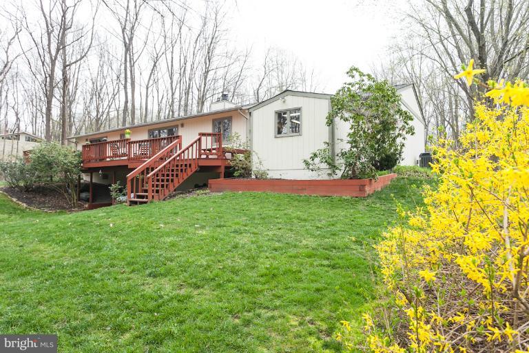14206 Sagewood Road Phoenix, MD 21131 - Photo 3 of 24 a front view of a house with garden