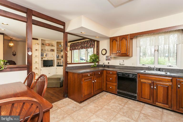 14206 Sagewood Road Phoenix, MD 21131 - Photo 23 of 24 a kitchen with stainless steel appliances granite countertop a stove a sink and a refrigerator