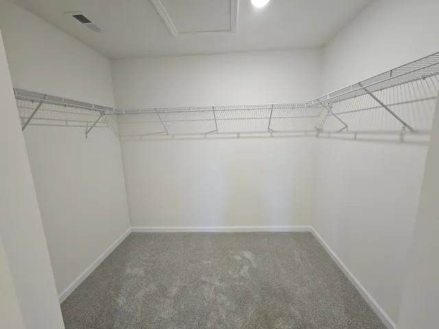 a view of a room with racks on the wall