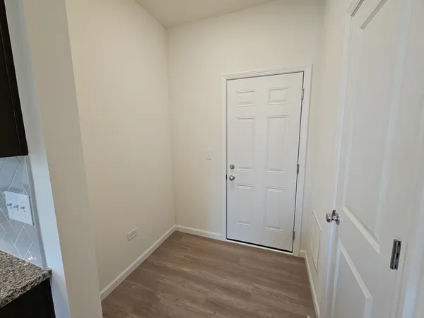 an empty room with wooden floor