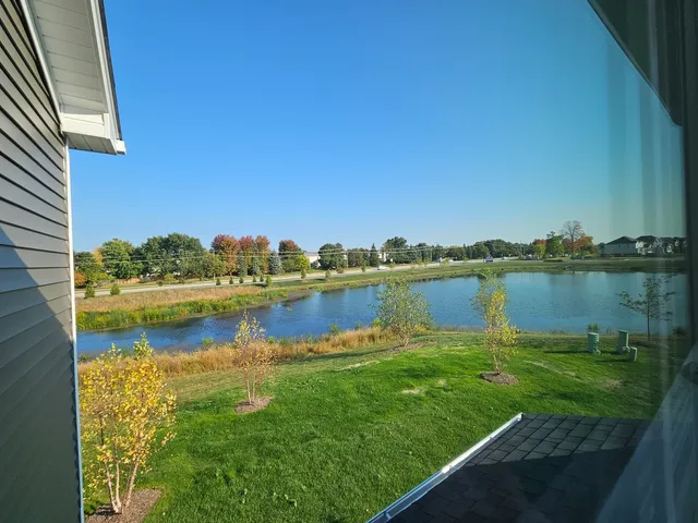 a view of a lake with houses in the back