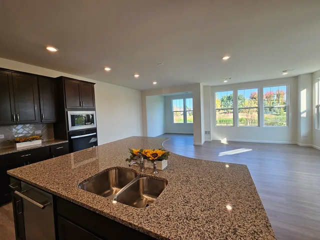 a kitchen with a sink and a window