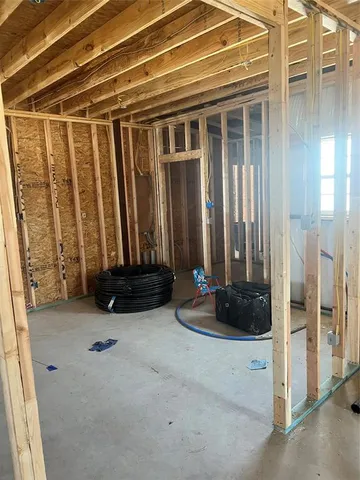 a view of a hallway with wooden walls and entryway