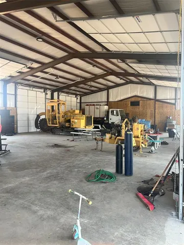 a view of a patio with table and chairs with wooden floor and fence