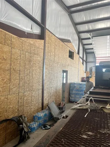 a room with a table and chairs