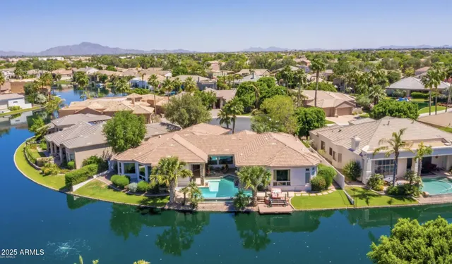 an aerial view of house with yard swimming pool and outdoor seating