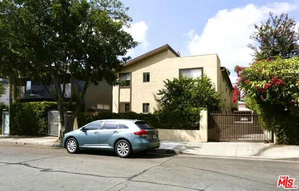 a view of a car parked in front of a house