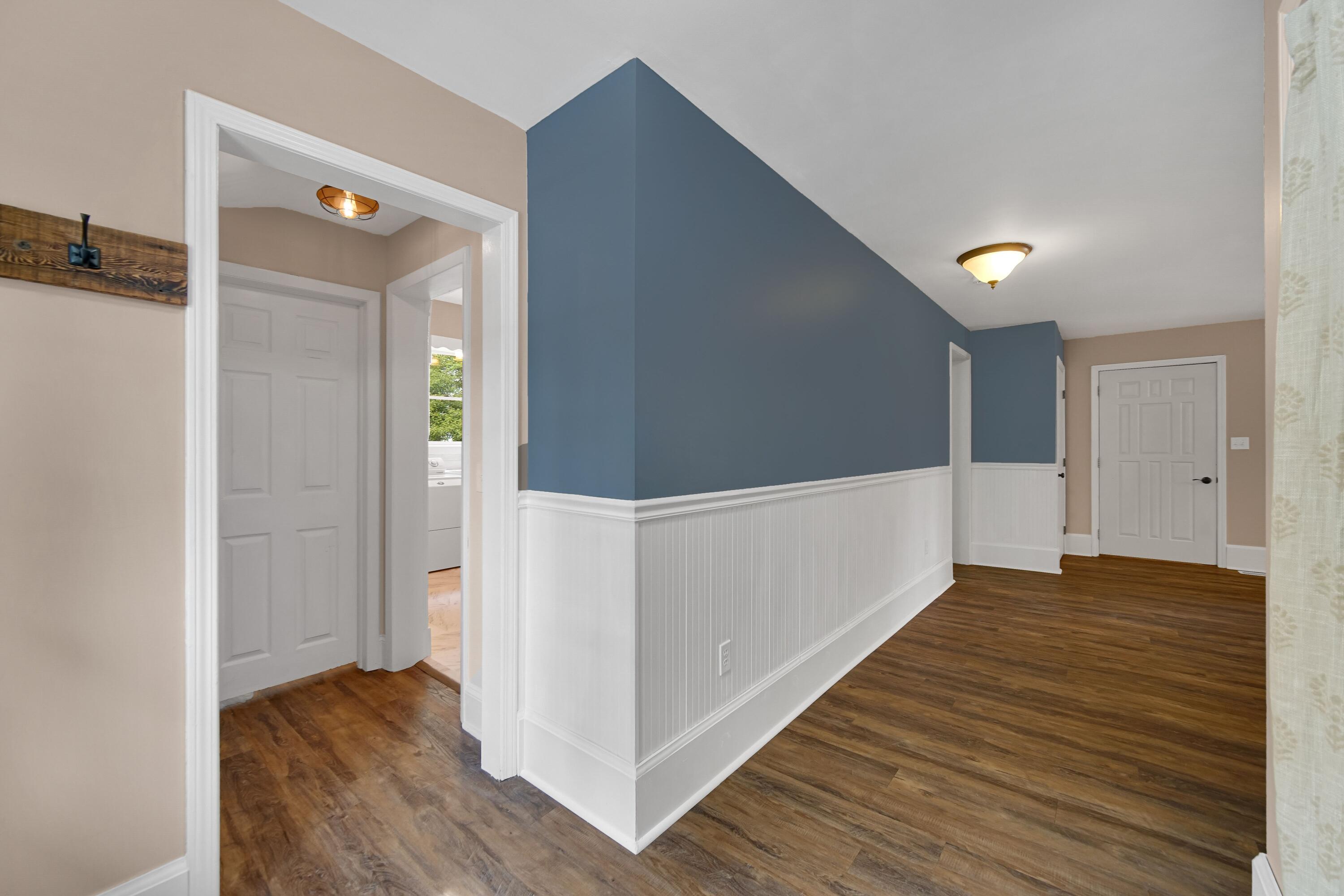 476 Highway 2 Hebron, IN 46341 - Photo 14 of 25 a view of hallway with stairs and wooden floor