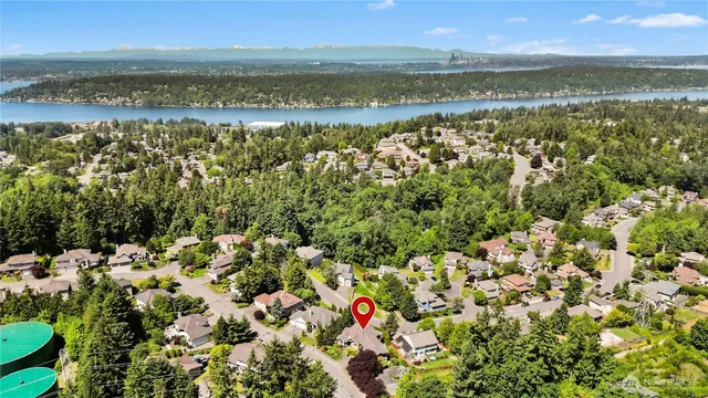a view of a room with wooden floor and windows