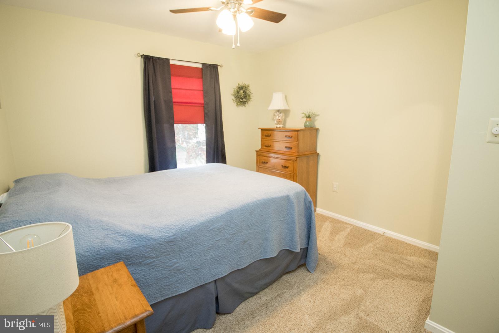 11620 Big Sandy Run Road Lusby, MD 20657 - Photo 13 of 64 a bedroom with a bed and a window