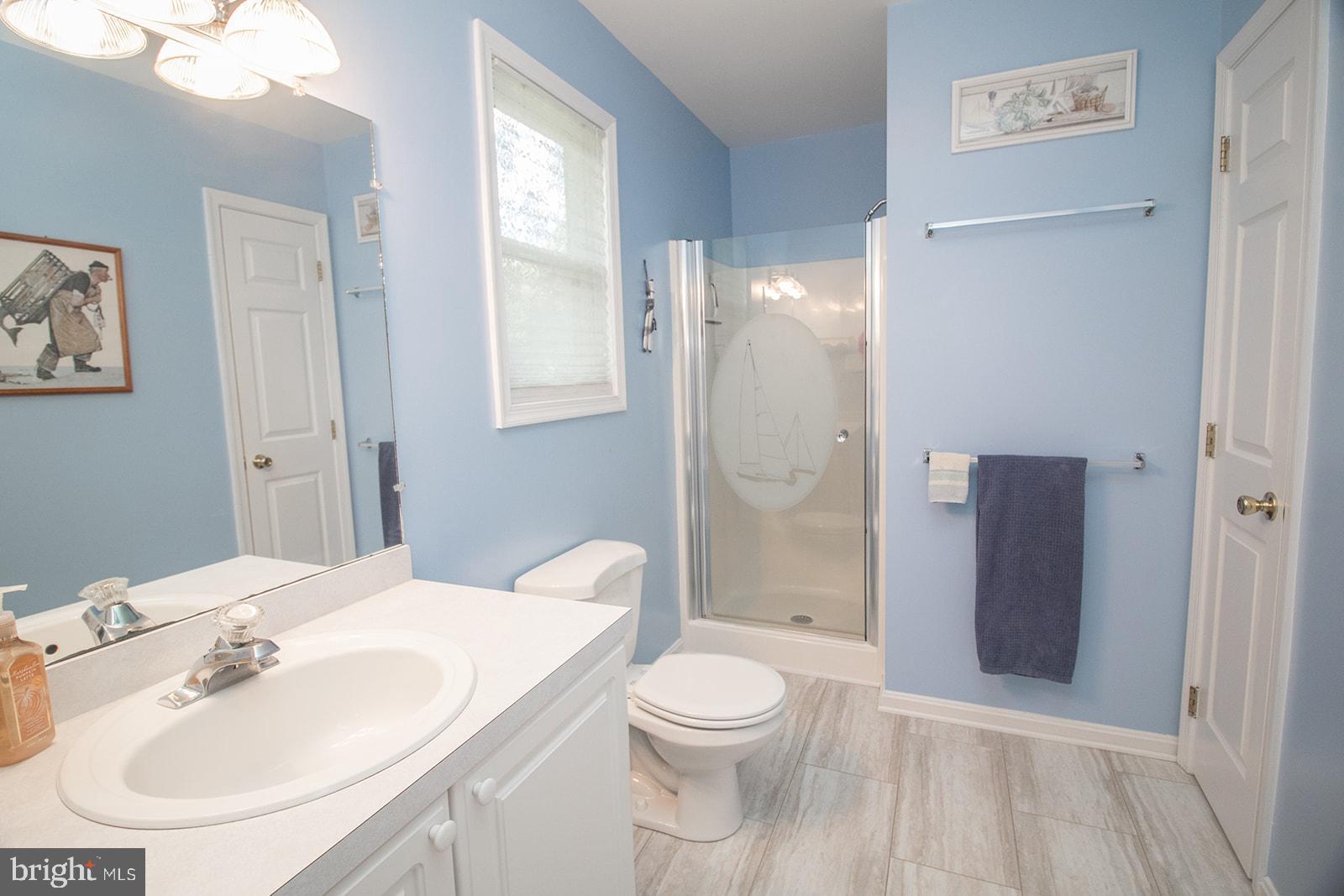 11620 Big Sandy Run Road Lusby, MD 20657 - Photo 19 of 64 a bathroom with a sink toilet and shower
