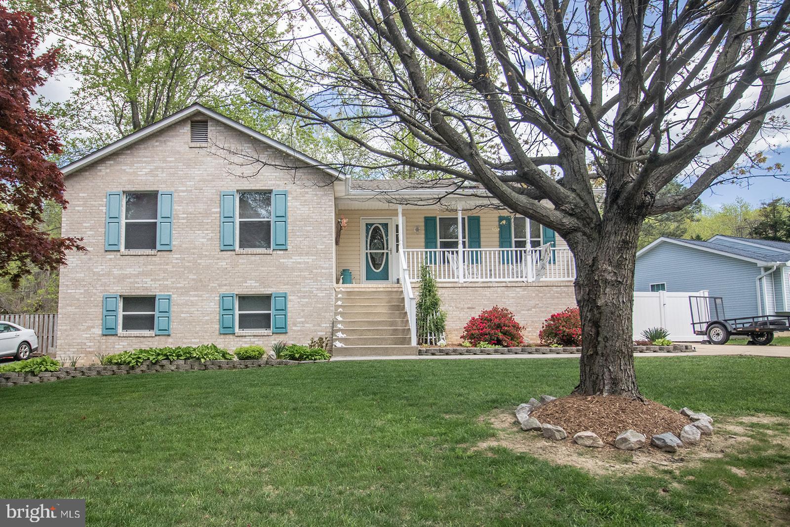 11620 Big Sandy Run Road Lusby, MD 20657 - Photo 2 of 64 a front view of a house with garden