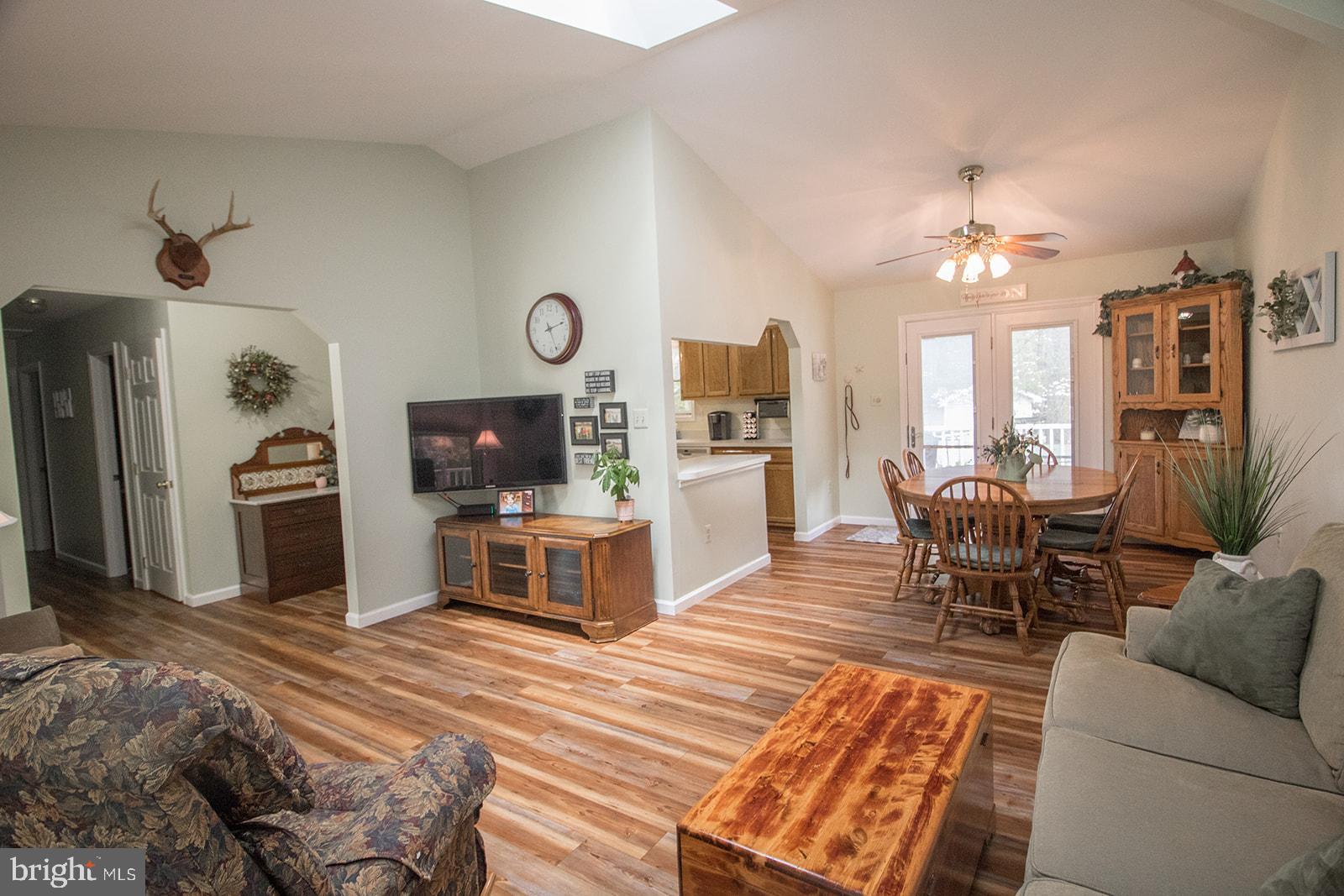 11620 Big Sandy Run Road Lusby, MD 20657 - Photo 26 of 64 a living room with furniture a fireplace and a flat screen tv