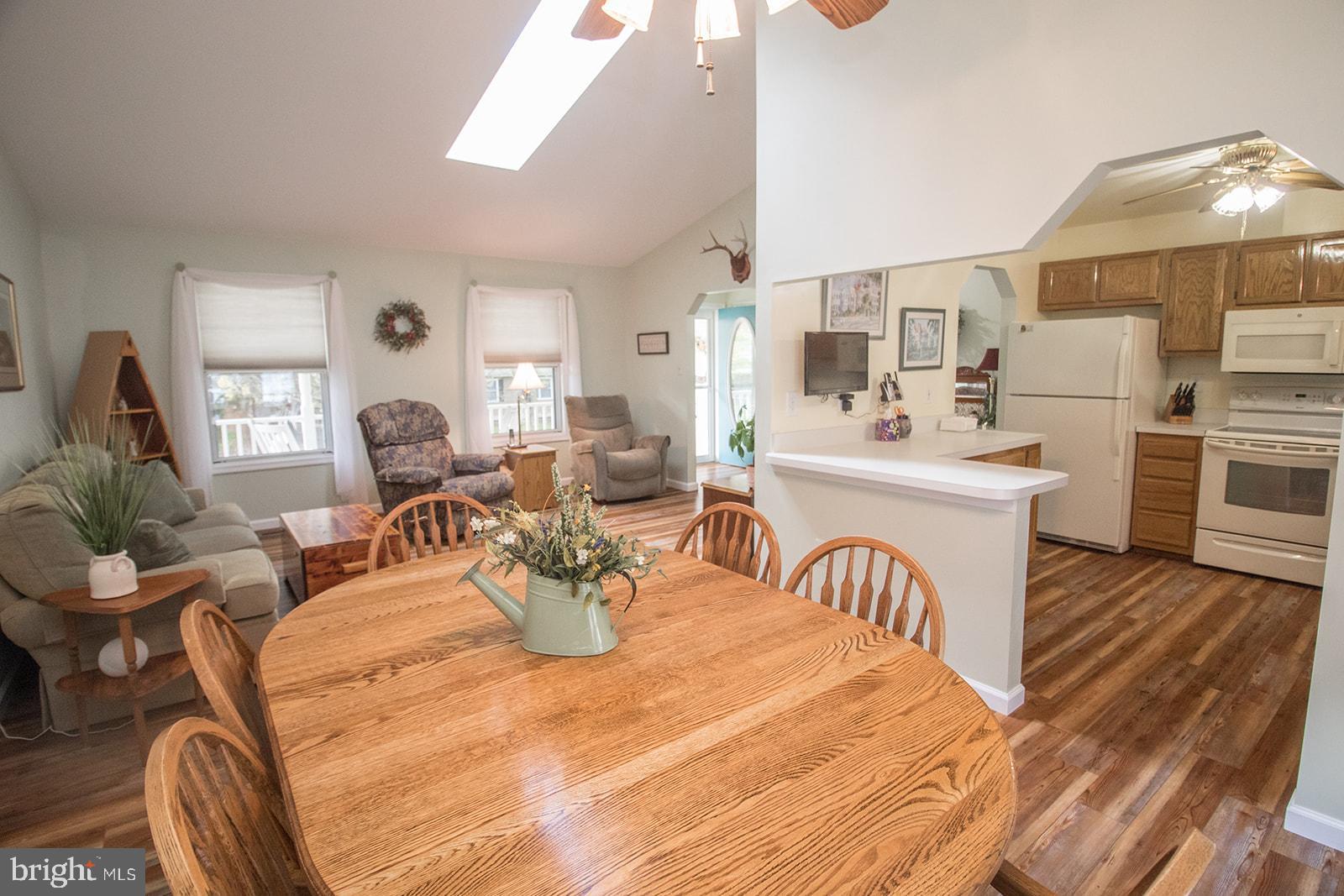 11620 Big Sandy Run Road Lusby, MD 20657 - Photo 29 of 64 a view of a dining room with furniture window and wooden floor