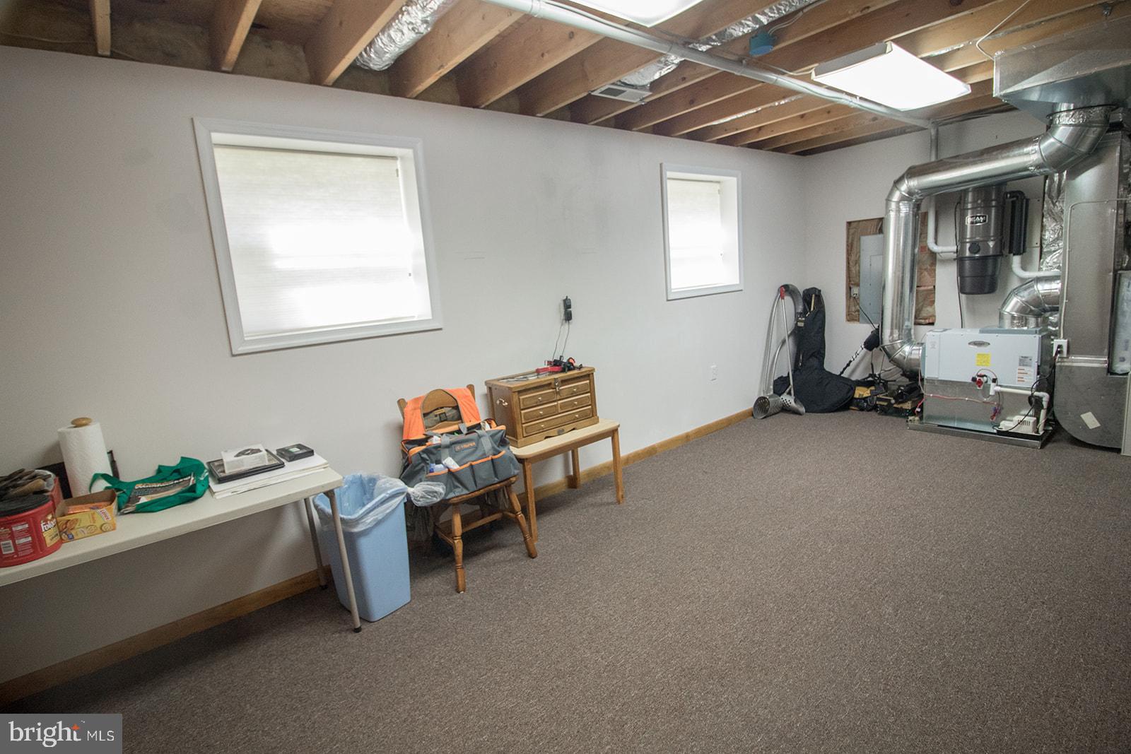11620 Big Sandy Run Road Lusby, MD 20657 - Photo 39 of 64 a room with furniture and a window