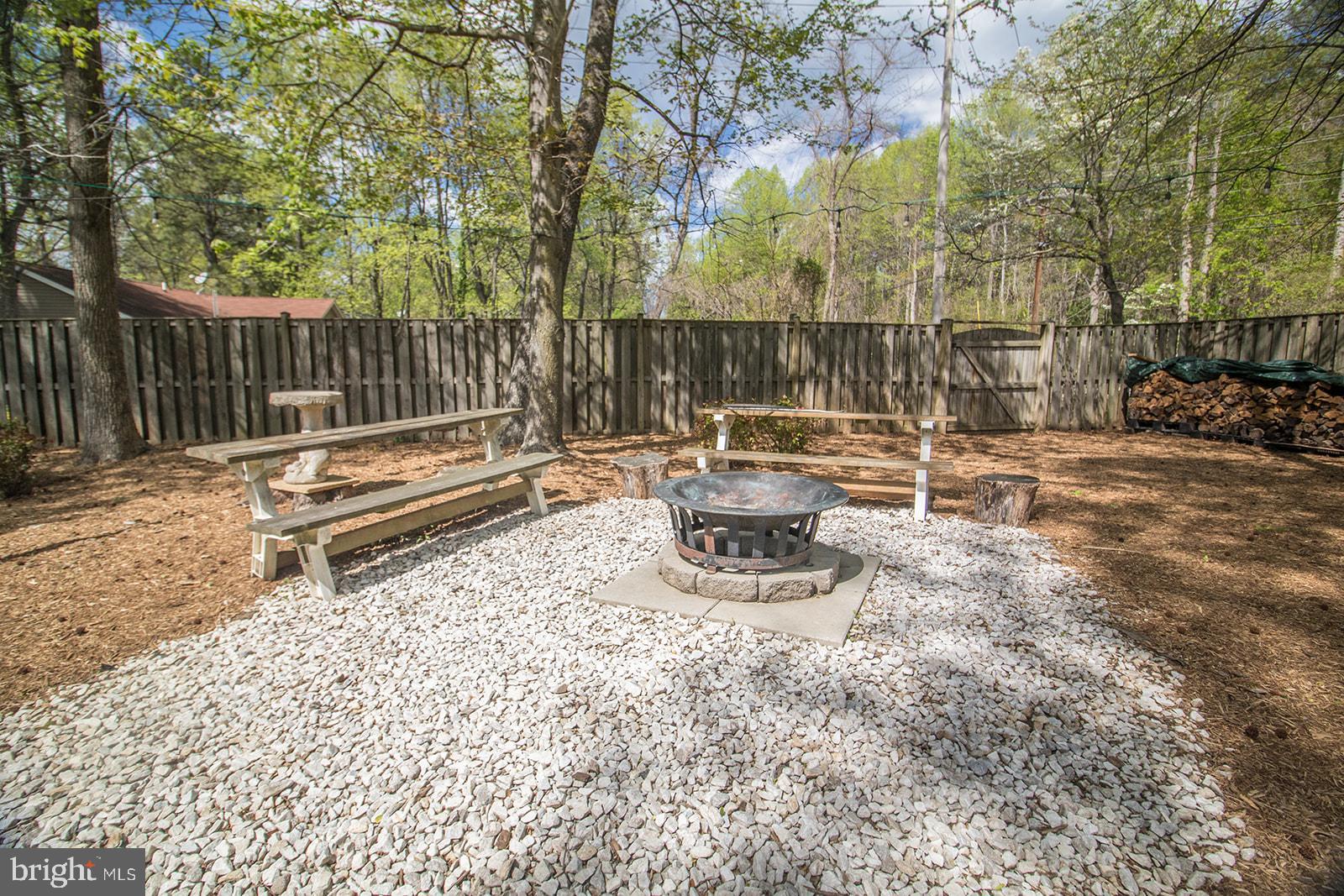 11620 Big Sandy Run Road Lusby, MD 20657 - Photo 48 of 64 a backyard of a house with table and chairs