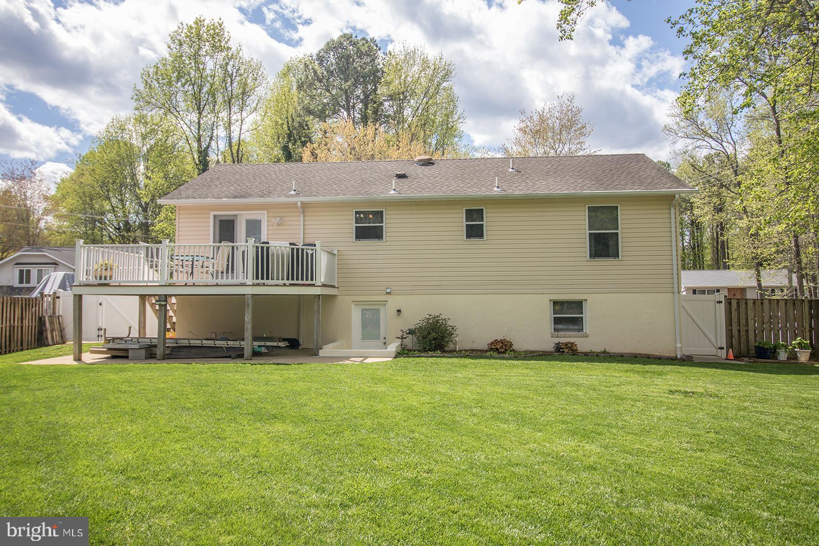 11620 Big Sandy Run Road Lusby, MD 20657 - Photo 50 of 64 a view of a house with a yard