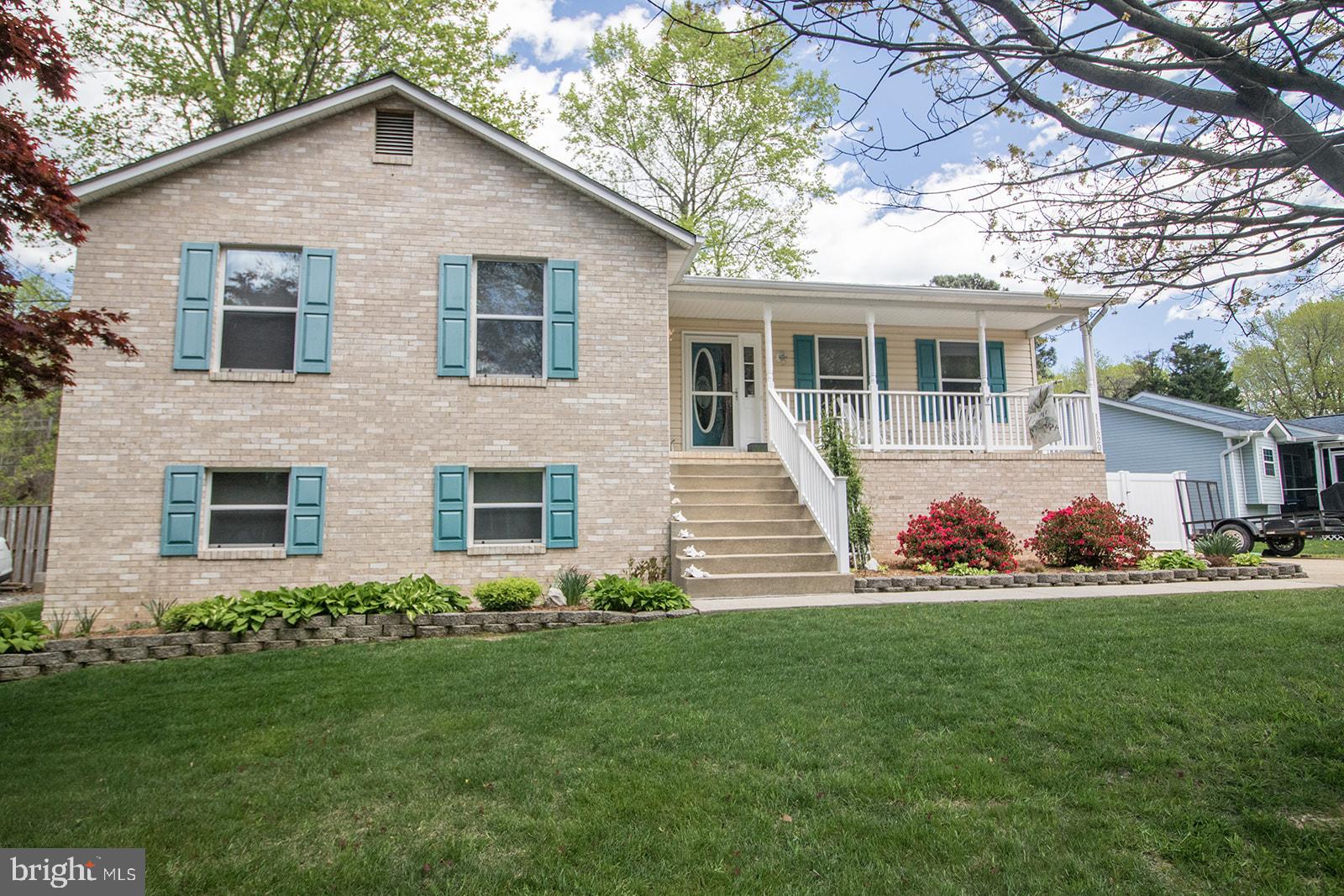 11620 Big Sandy Run Road Lusby, MD 20657 - Photo 5 of 64 a front view of house with yard and green space