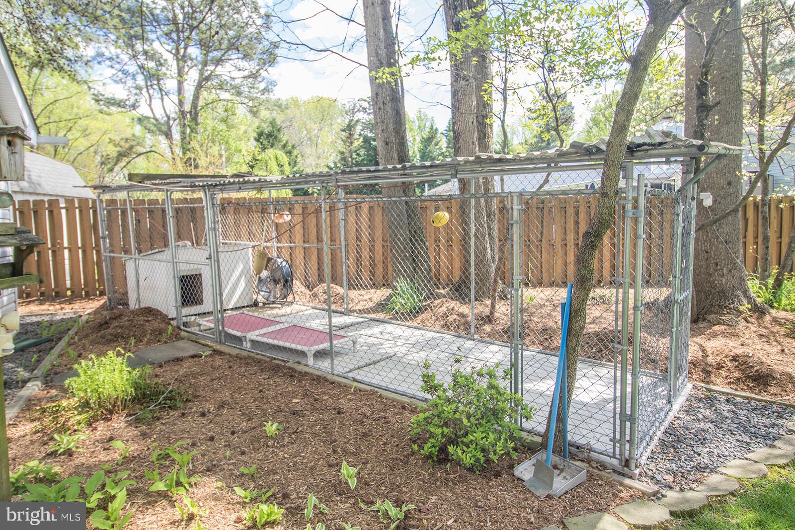 11620 Big Sandy Run Road Lusby, MD 20657 - Photo 52 of 64 a backyard of a house with table and chairs